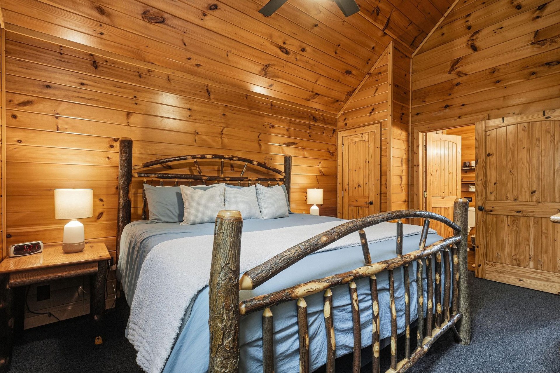 Sink into the rustic charm of this cozy cabin bedroom, where handcrafted wood details and soft linens invite your most restful nights sleep.