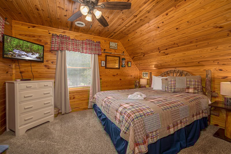 queen bed, dresser and TV