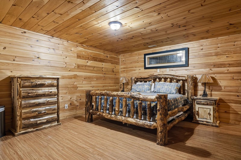 Retreat into this handcrafted log bedroom where rustic charm meets comfort, featuring beautiful wood details and cozy furnishings for your peaceful mountain getaway.