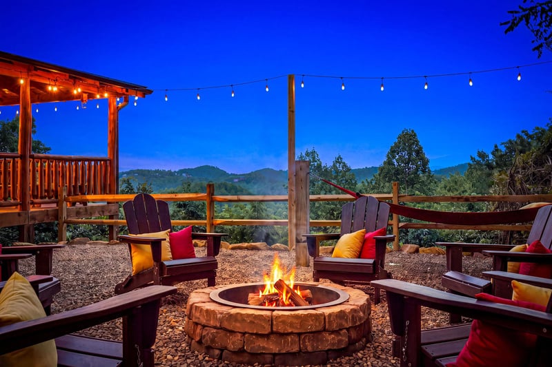 Gather around the crackling fire as twilight settles over the mountains, where Adirondack chairs invite you to sink in and savor the peaceful retreat with a warm drink in hand.