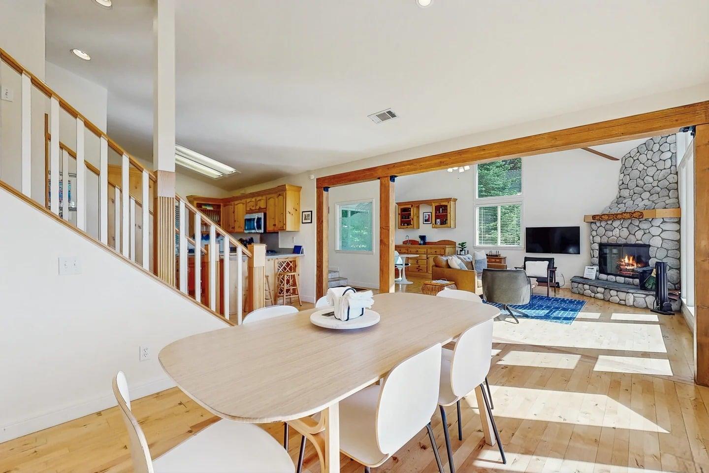Dining area with table, chairs for 6 guests, and 1 of 3 fireplaces.