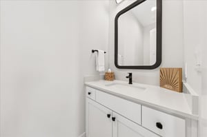 First floor powder room  located just off the game lounge
