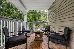Outdoor seating around stone fire pit table