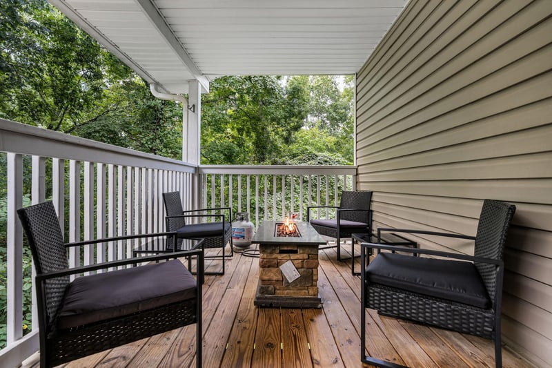 Outdoor seating around stone fire pit table