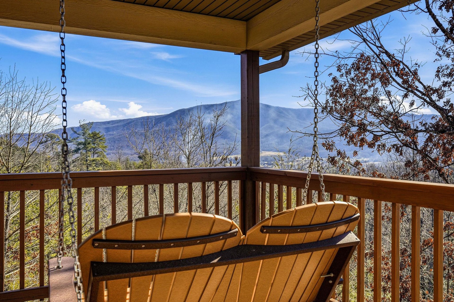 Unwind on your private porch swing while soaking in breathtaking mountain vistas that stretch endlessly before you.