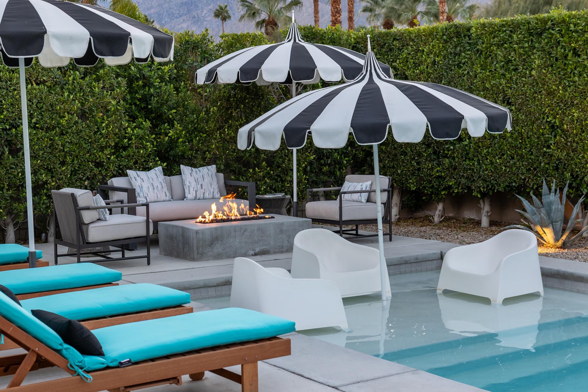 Chic loungers and a cozy fire pit