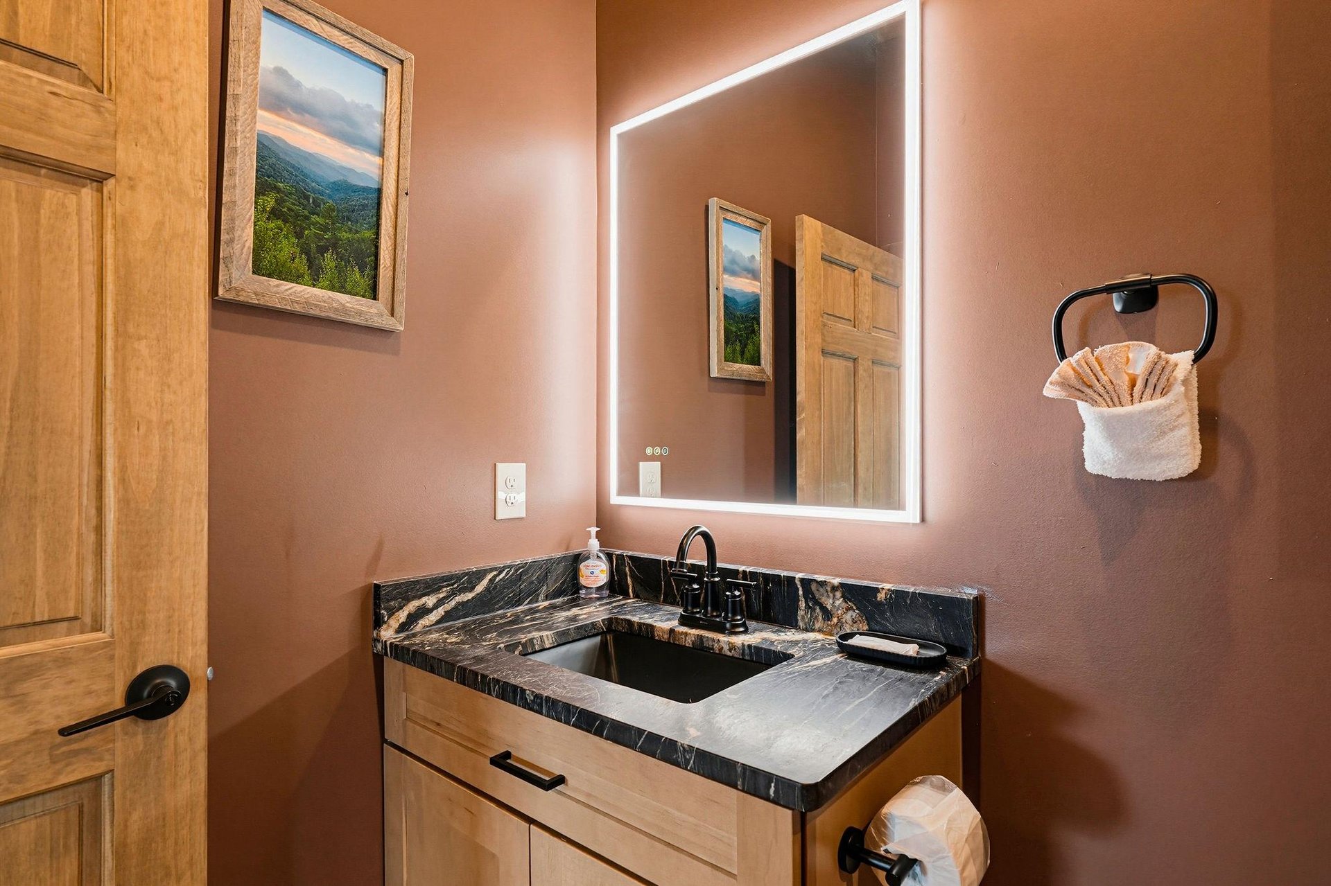 Your ensuite features warm lighting, elegant marble countertops, and plush towels—perfect for unwinding after a day of adventure.