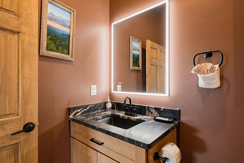 Your ensuite features warm lighting, elegant marble countertops, and plush towels—perfect for unwinding after a day of adventure.