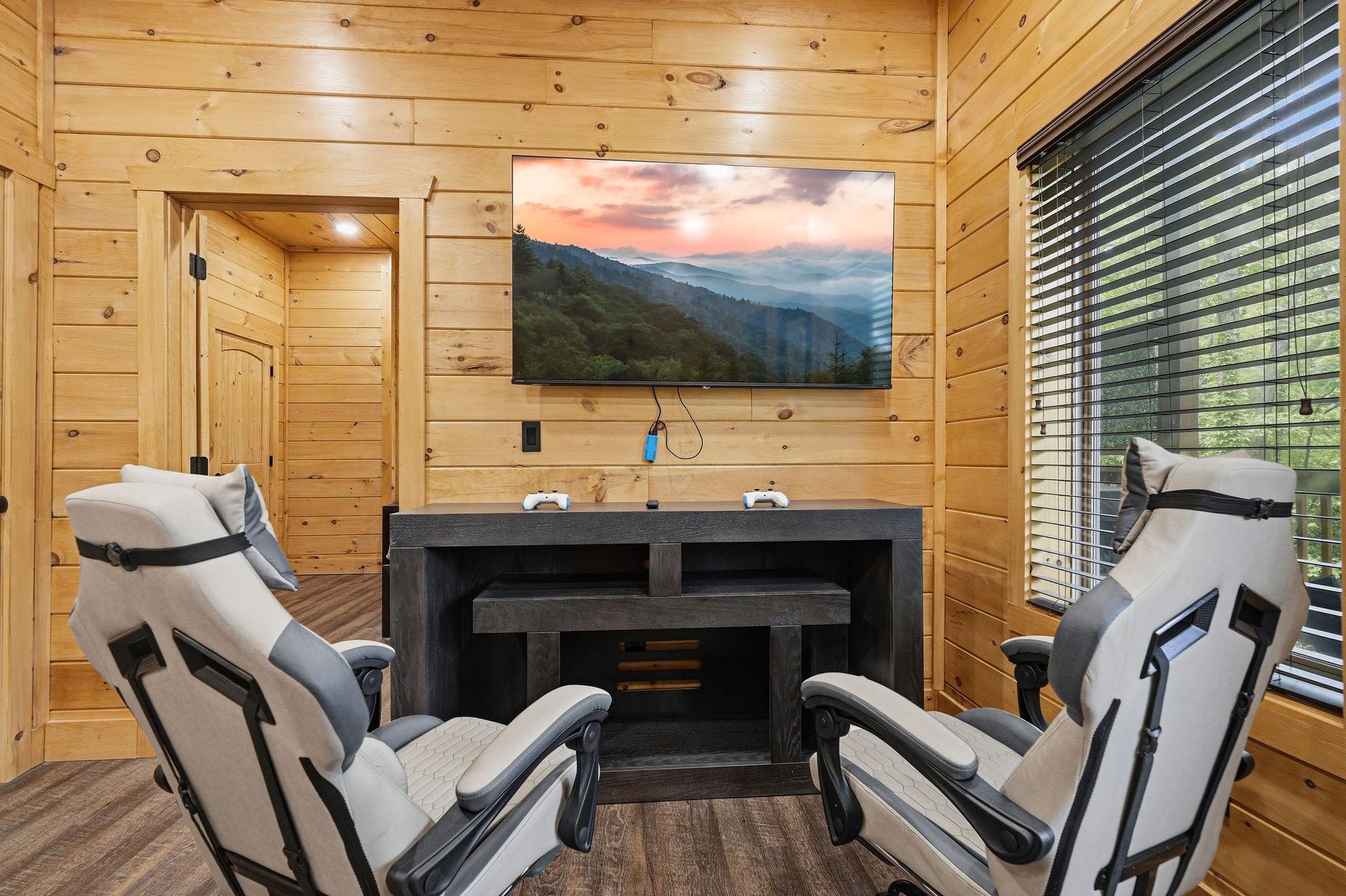 Unwind in your private massage room with cozy seating and mountain views on the big screen.