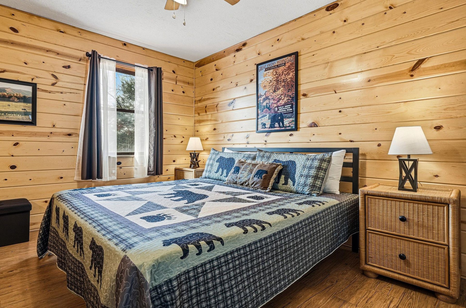 Drift off to sleep surrounded by warm pine walls and cozy bearthemed bedding in this rustic mountain bedroom retreat.