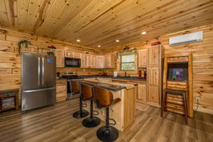 Full kitchen with island and arcade game