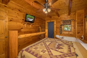 Queen bed jacuzzi and door to deck