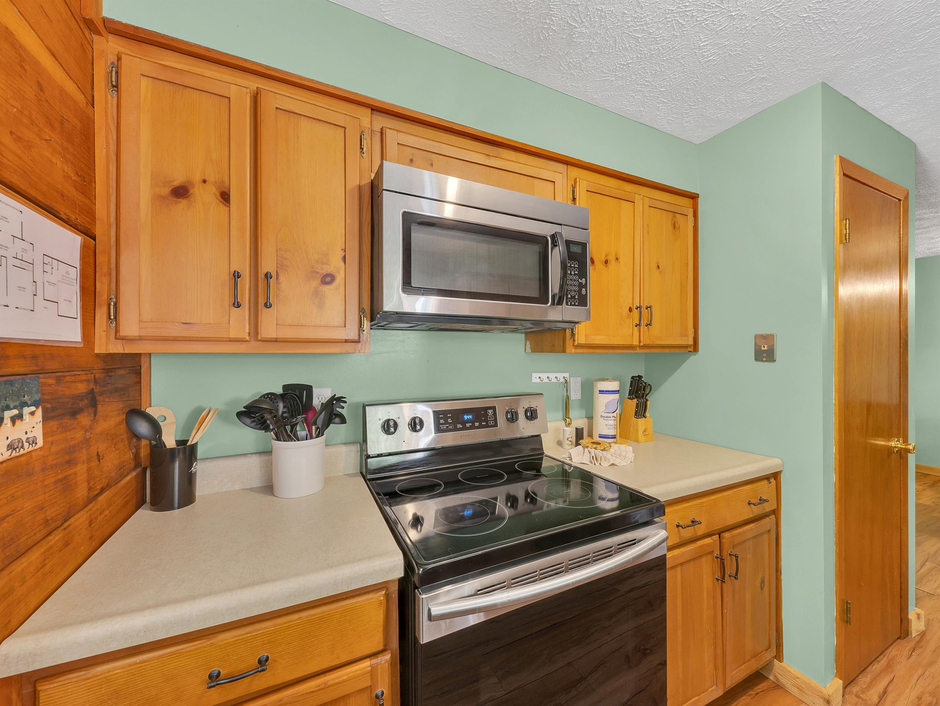 Your fullyequipped kitchen features warm wood cabinetry, modern appliances, and all the essentials for preparing your favorite meals during your stay.