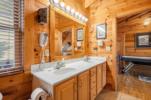 Step into your private rustic retreat, where warm pine surrounds you and thoughtful touches like fresh towels and cozy lighting make you feel right at home.