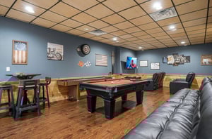Unwind in your private game room featuring a premium pool table, comfortable leather seating, and entertainment center for memorable evenings with family and friends.
