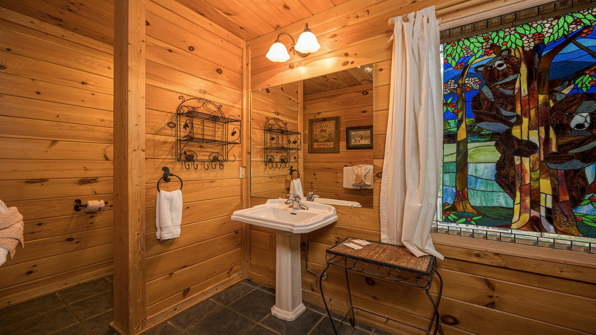 Pedestal sink with stained glass window
