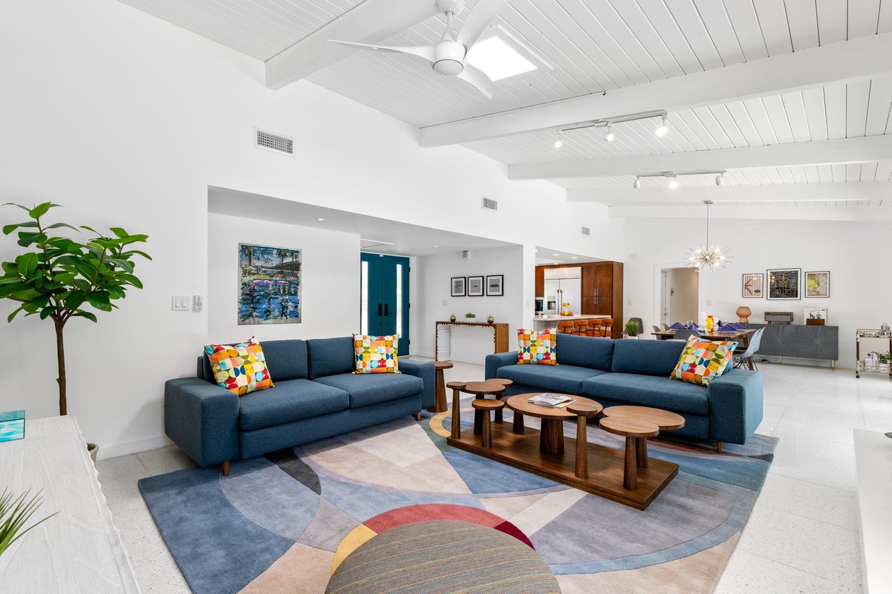 Living room flows into the dining area and kitchen.