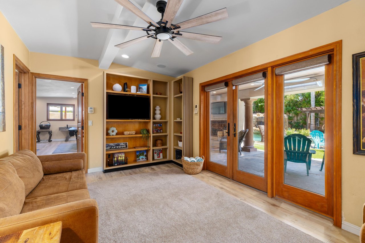 Additional living space, flatscreen TV, patio access, workout equipment, arcade game, darts, pool table, ping pong table, and shuffle board.