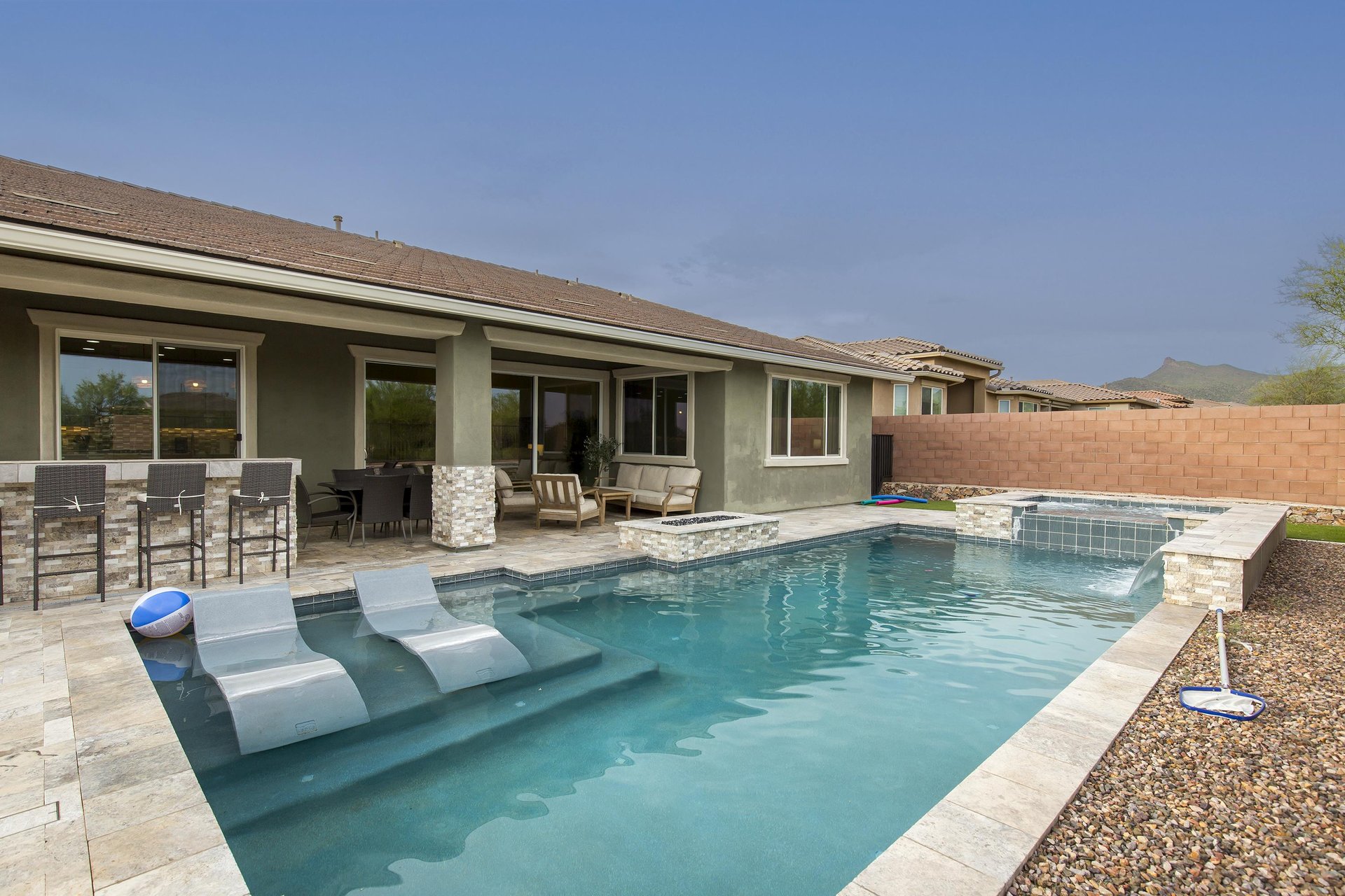 Private pool and spa with inwater lounge chairs.