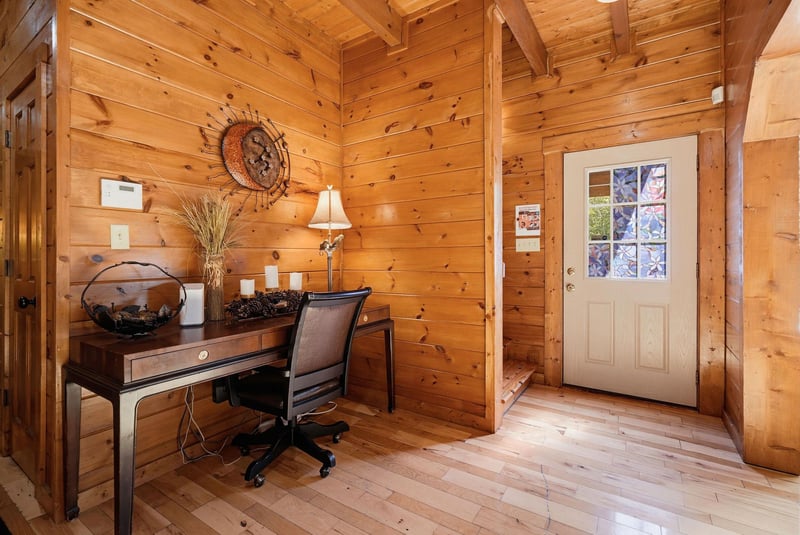 Your private workspace in a cozy woodpaneled retreat, where rustic charm meets modern convenience. The perfect spot to catch up on emails or plan your next adventure.