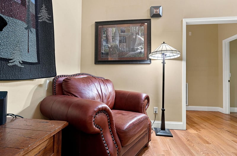 Sink into this inviting leather armchair, perfect for your morning coffee or quiet reading moments. The warm ambiance and classic touches create your ideal relaxation spot.