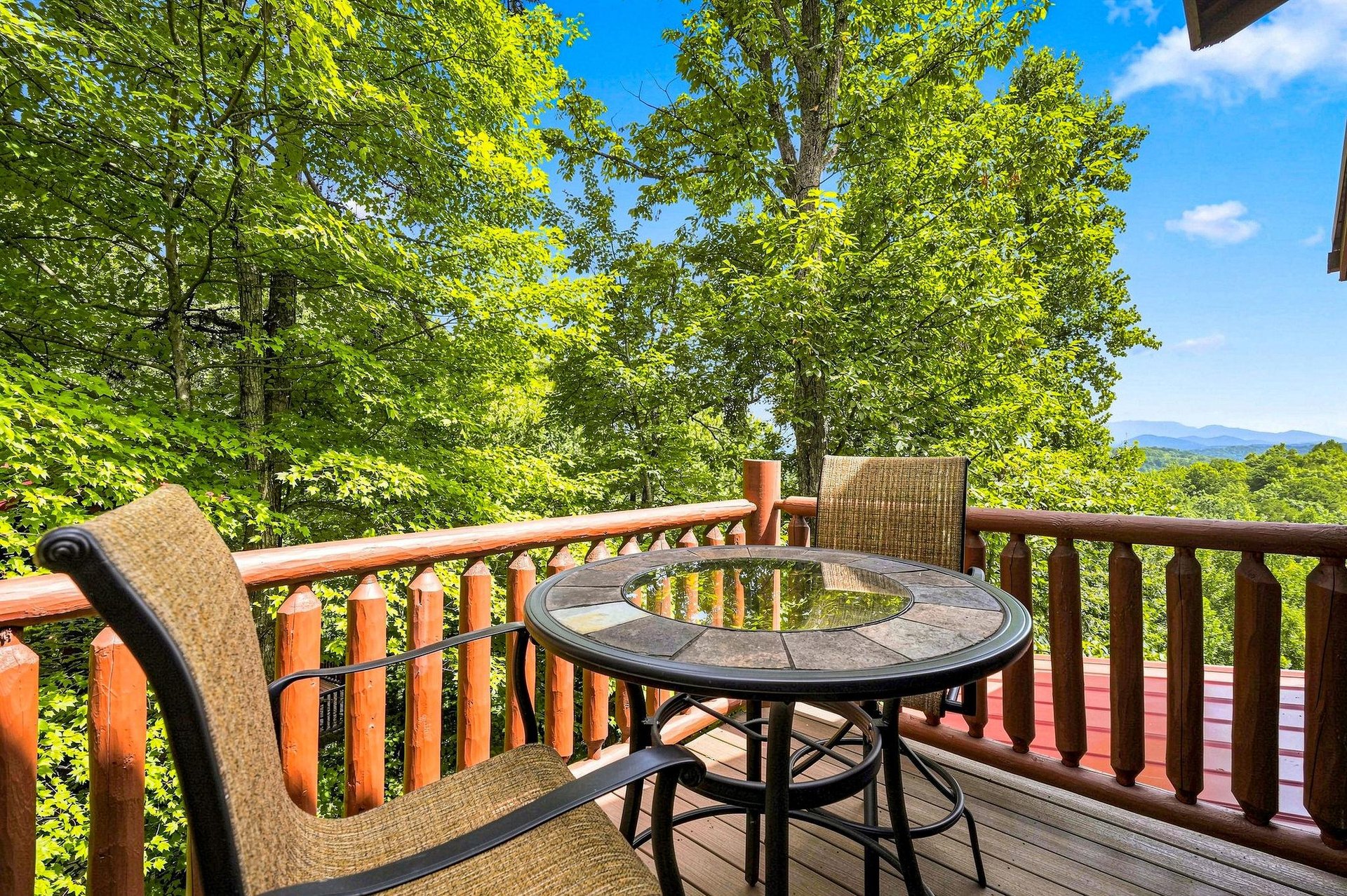 Sip your morning coffee surrounded by lush trees and mountain scenery—your private deck invites you to relax in natures embrace.