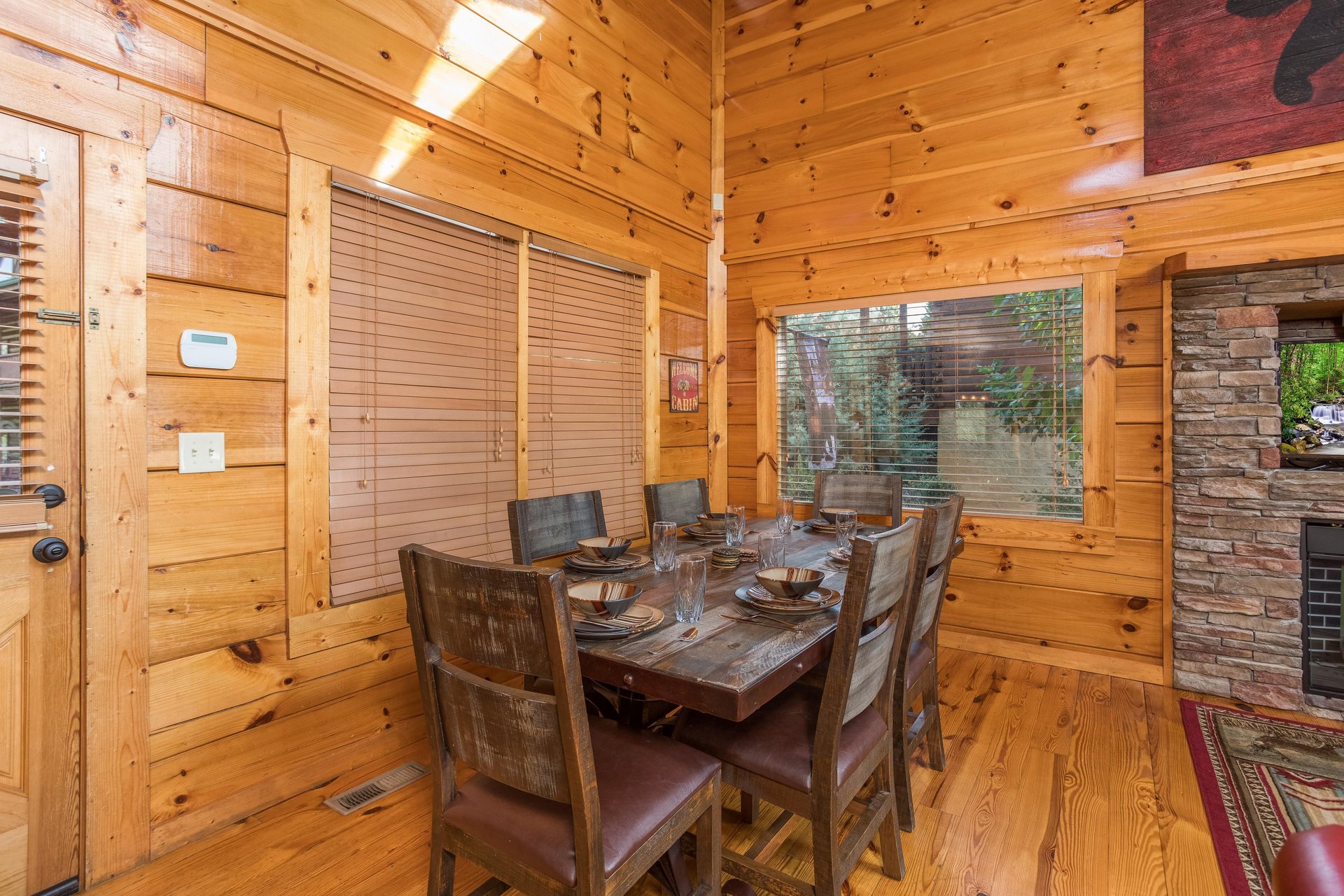 Dining room with table for 6 at Graceland, a 4bedroom cabin rental located in Pigeon Forge