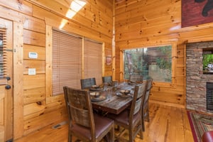 Dining room with table for 6 at Graceland, a 4bedroom cabin rental located in Pigeon Forge