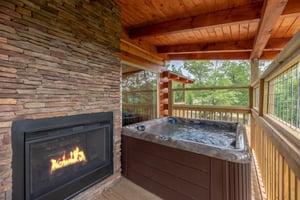 Hot tub beside fireplace