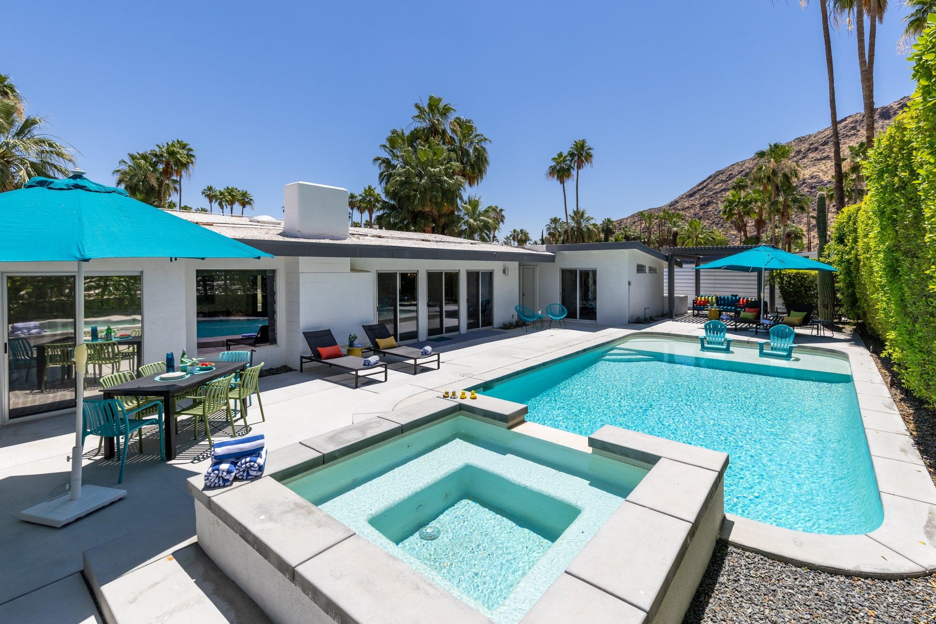 View of the pool, spa, and patio area.
