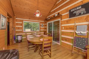 Dining table for six at Cubs Crib, a 3 bedroom cabin rental located in Gatlinburg