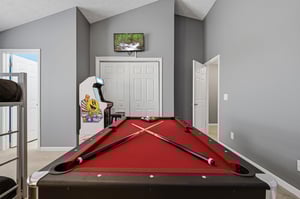 Challenge your friends to a game of pool in your private game room, complete with vintage arcade fun and a TV for entertainment breaks.