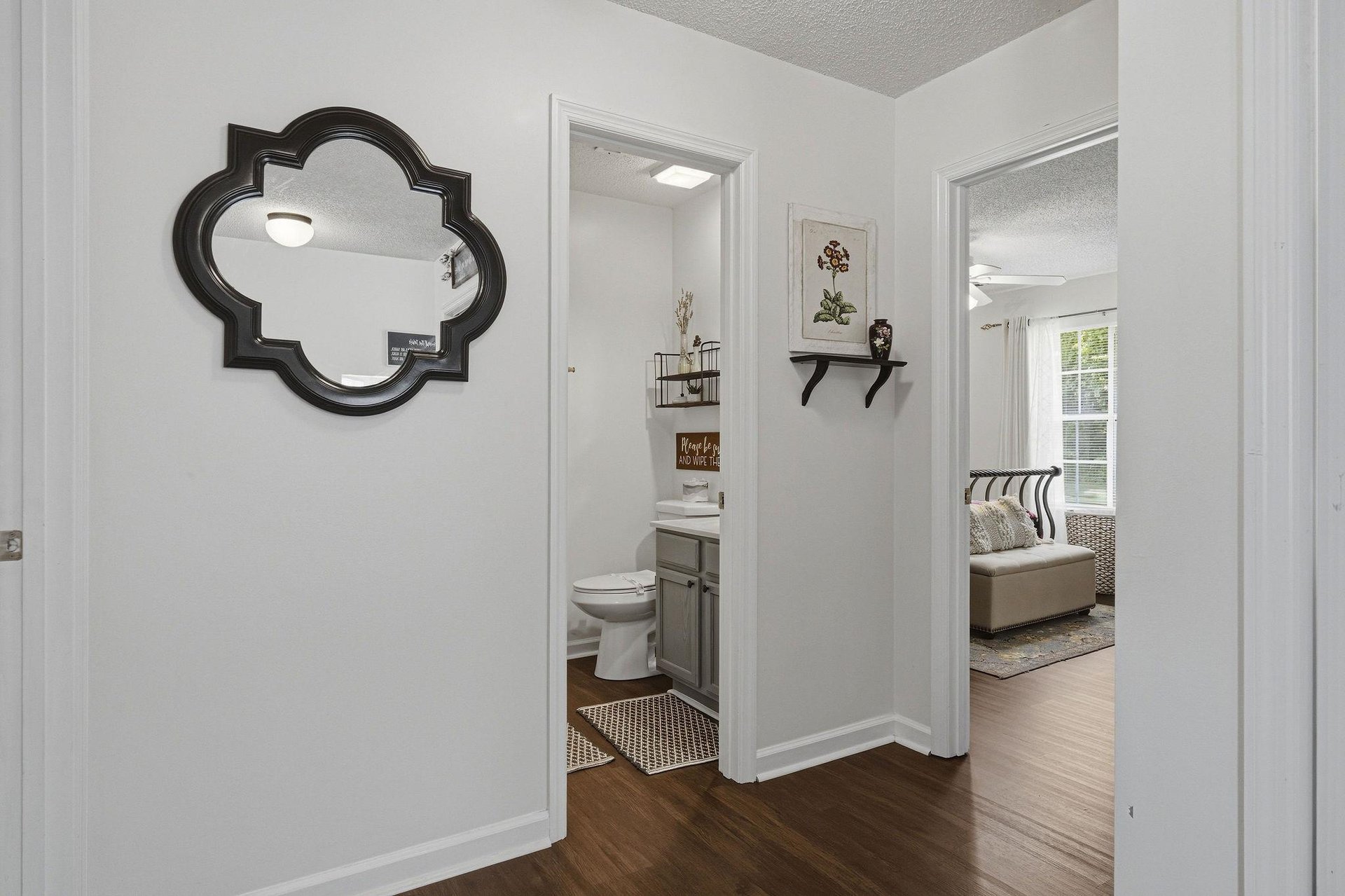 Step into your own charming retreat, where a welcoming hallway connects your cozy bedroom with a wellappointed bathroom—perfectly designed for your comfort and ease during your stay.