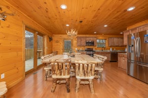 Dining room and kitchen at Js Hideaway, a 4 bedroom cabin rental located in Pigeon Forge