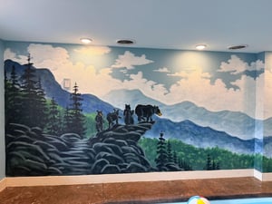 Immerse yourself in this stunning mountain wilderness mural featuring bears on rocky cliffs surrounded by pristine forest landscapes.