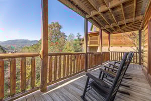 Rocking chairs on a deck at Bears Dont Bluff, a 3 bedroom cabin rental located in Pigeon Forge