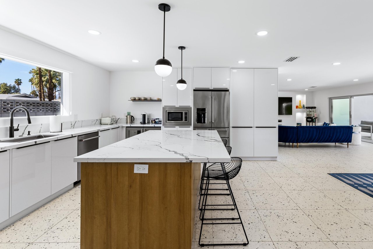 Open flow kitchen and dining room flow into the living room