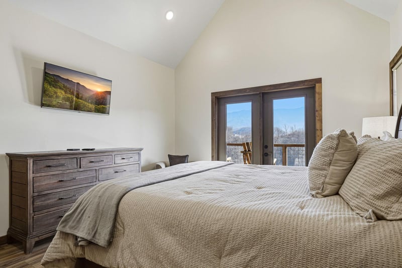 Sink into plush bedding and wake to stunning mountain views through your private balcony doors.