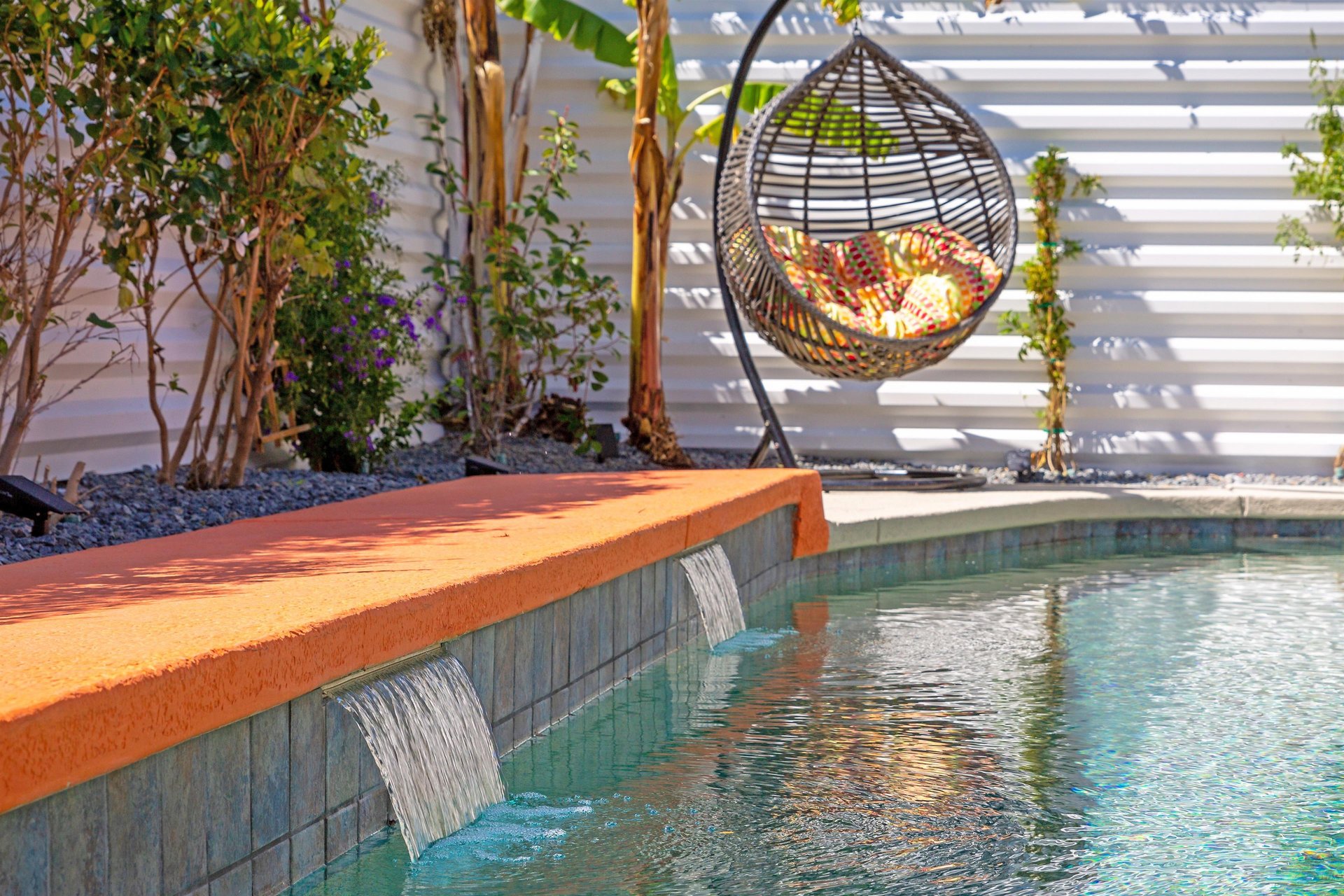 Waterfall water feature in the resortstyle pool