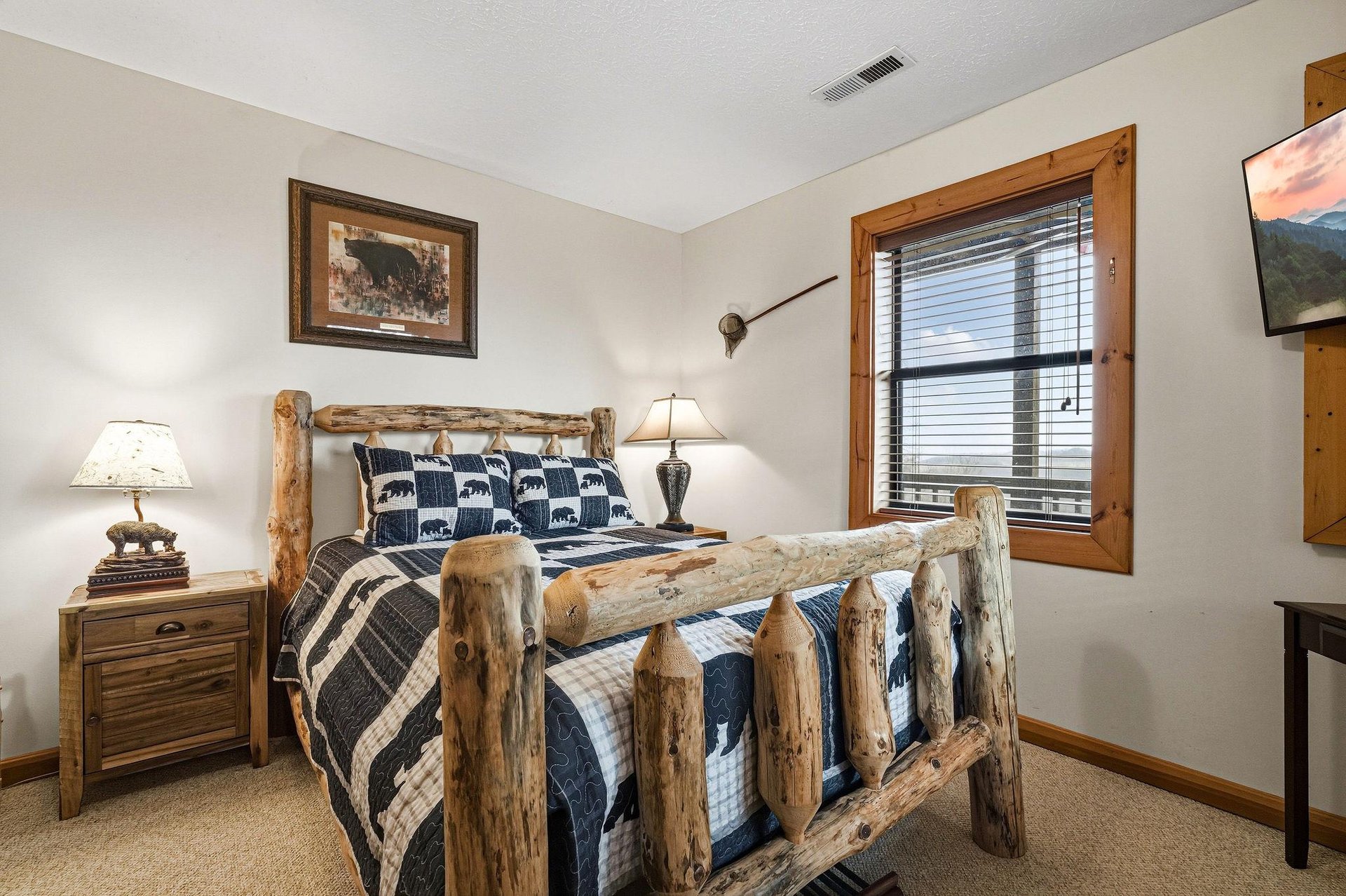 Drift off in your rustic log bed surrounded by mountaininspired decor, soft lighting, and cozy wilderness charm.