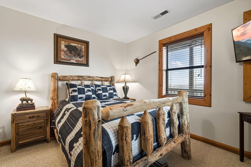 Drift off in your rustic log bed surrounded by mountaininspired decor, soft lighting, and cozy wilderness charm.