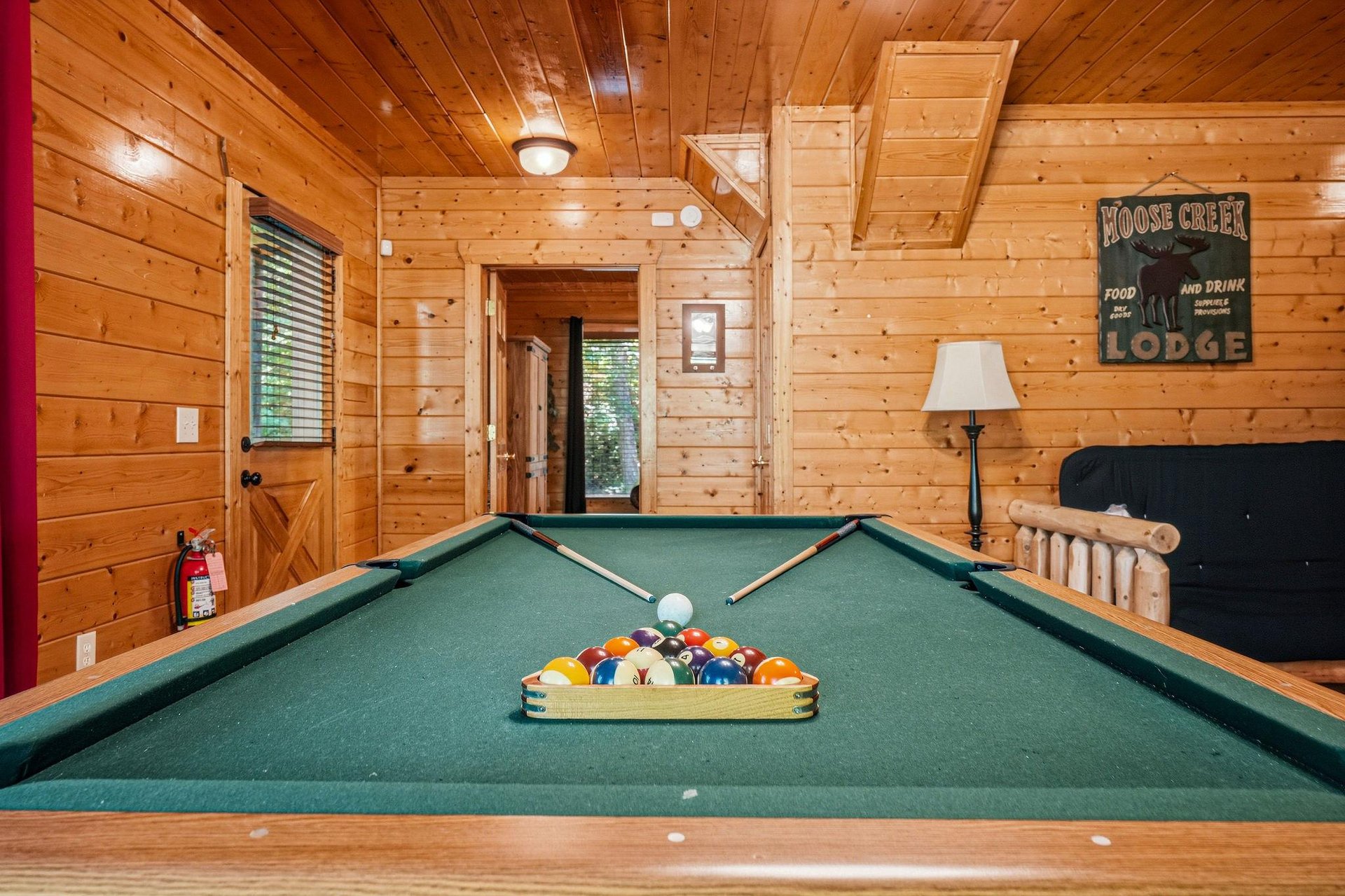 Challenge your crew to a friendly game in your private billiards room, where warm wood tones and rustic charm make every shot feel special.