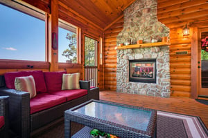 Cozy up by the stone fireplace in this warm woodpaneled space, perfect for unwinding after exploring the mountains youll see through the windows.