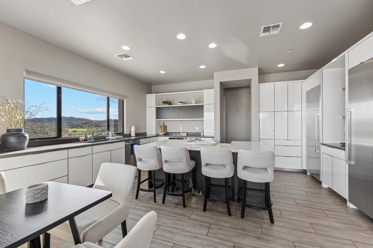 Chefs kitchen with plenty of counter space, kitchen island with counter seating for 4, additional table and chairs for 3  great for morning coffee.