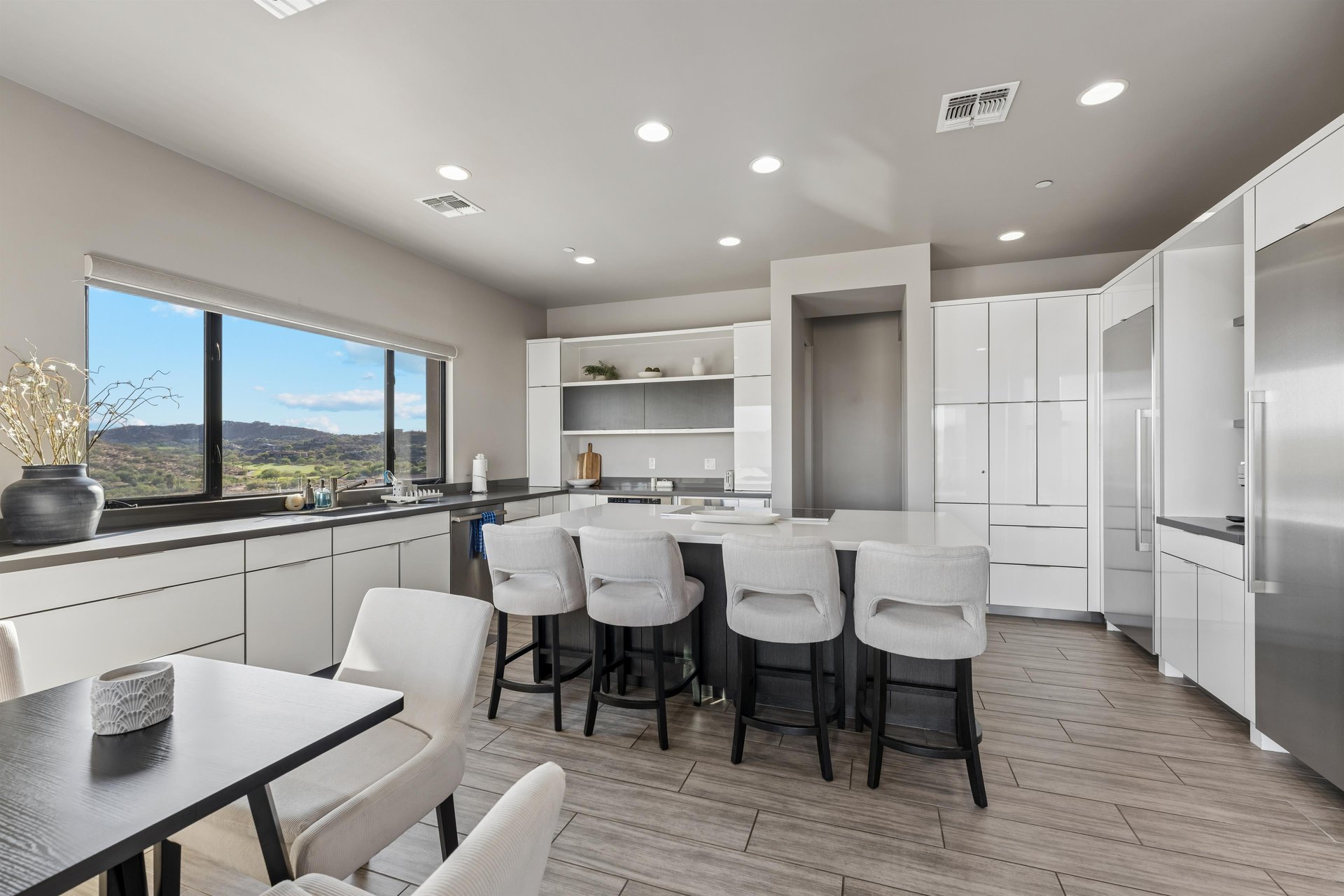 Chefs kitchen with plenty of counter space, kitchen island with counter seating for 4, additional table and chairs for 3  great for morning coffee.