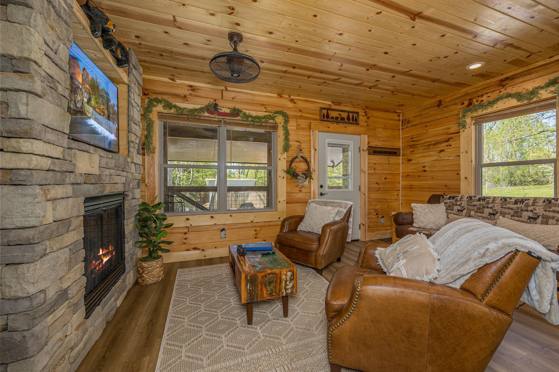 Living room with stone fireplace