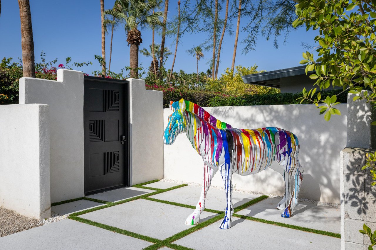 Colorful zebra sculpture near front gate ready to welcome guests.