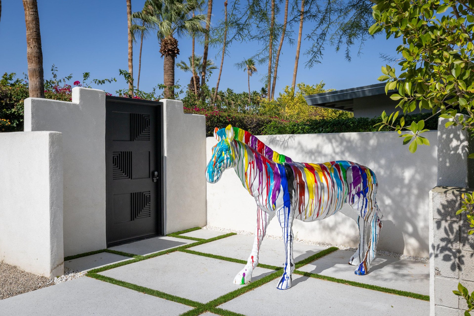 Colorful zebra sculpture near front gate ready to welcome guests.