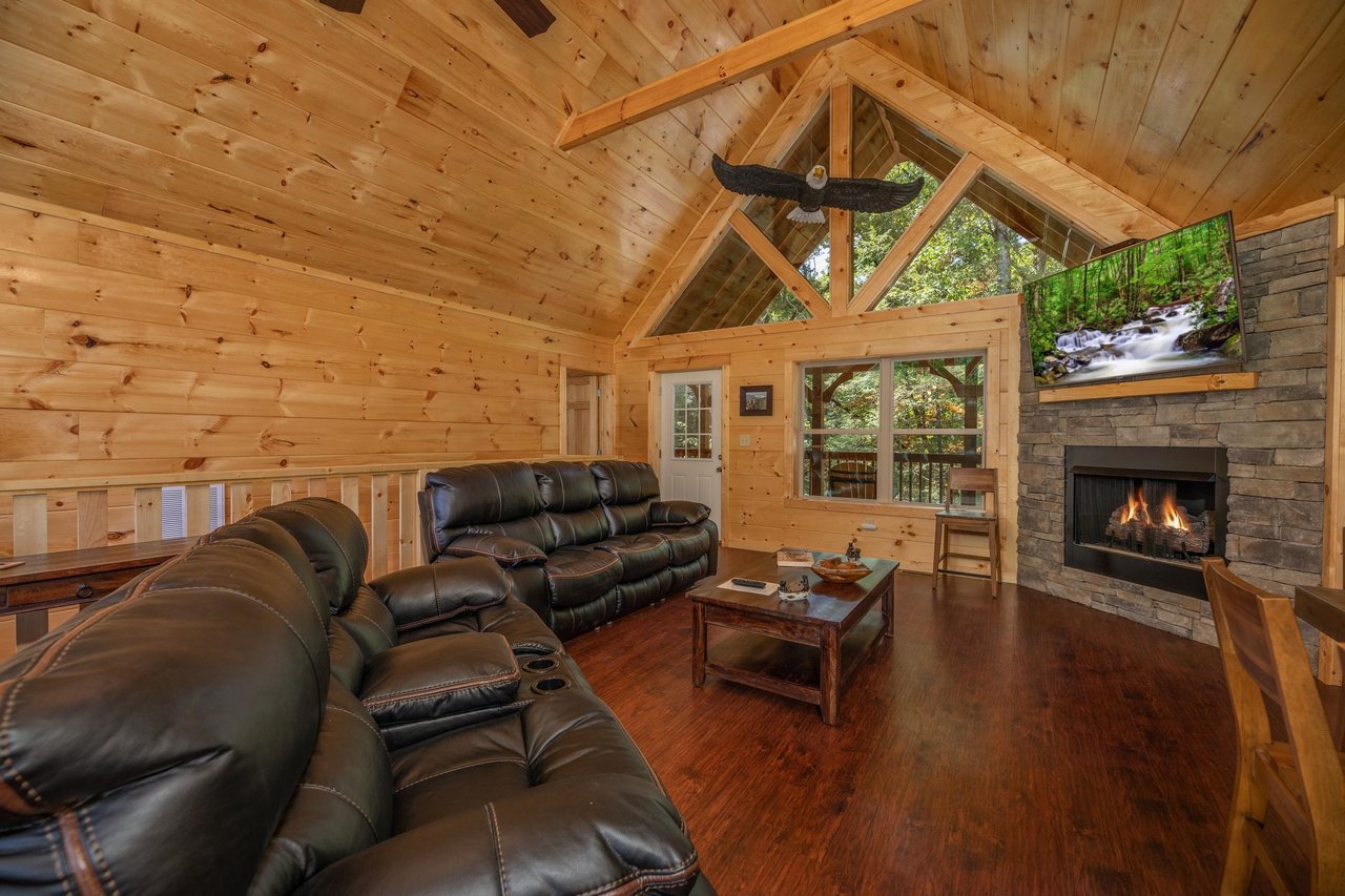 Living room with stone fireplace