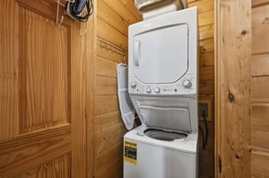 Your laundry stays fresh with convenient incabin washer and dryer, surrounded by warm wood walls.